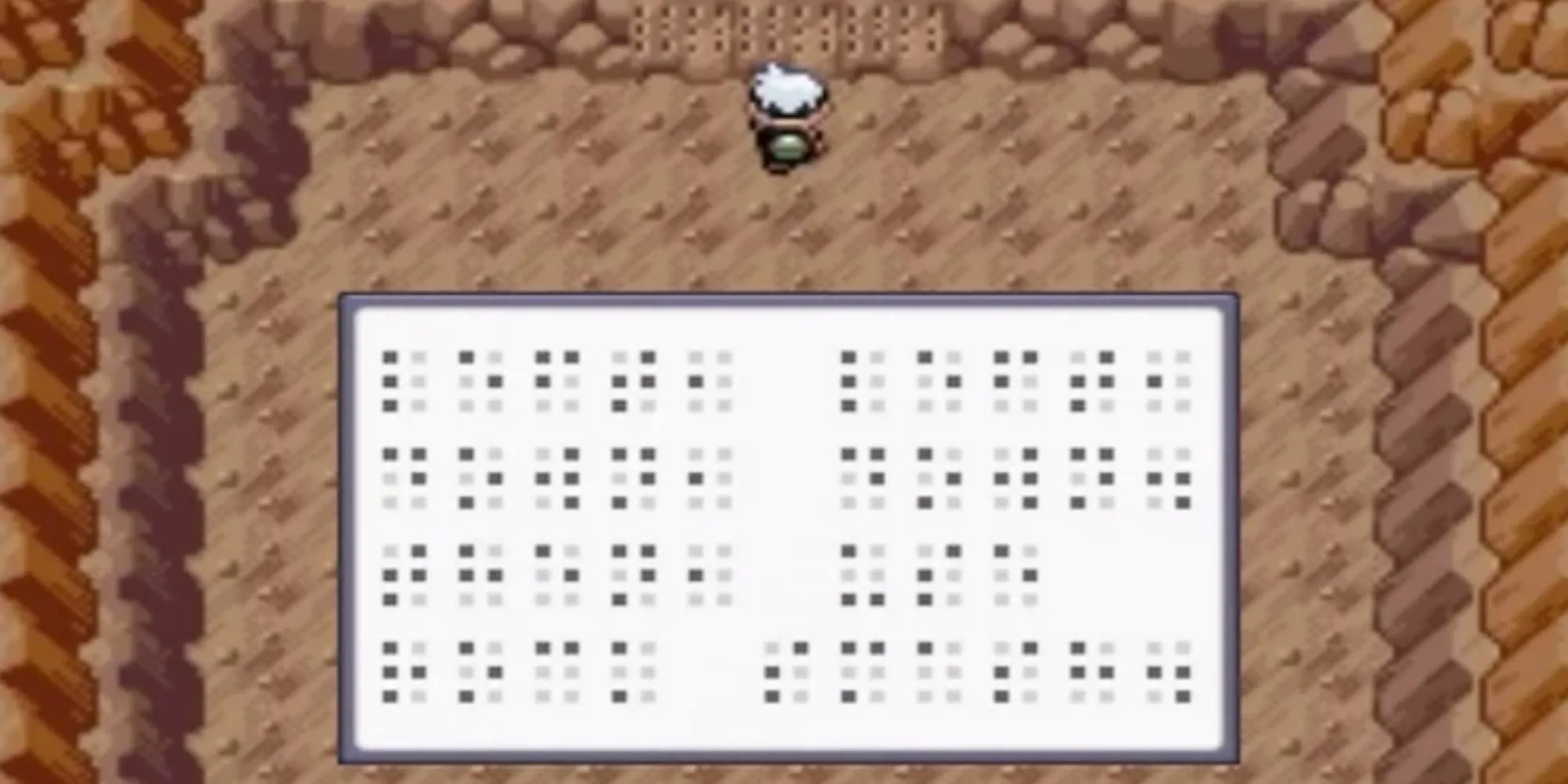 Bức tường khắc chữ nổi Braille trong hang động game Pokemon Ruby