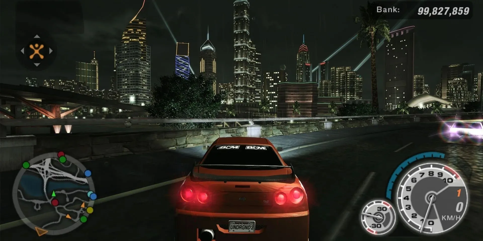 Cảnh đua xe Need For Speed Underground 2 trên PS2 với chiếc Nissan Skyline lướt trên cao tốc thành phố về đêm