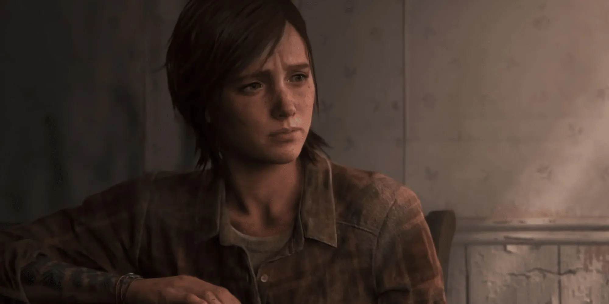 Ellie ngồi một mình trong căn nhà trống vắng ở cuối The Last of Us Part 2