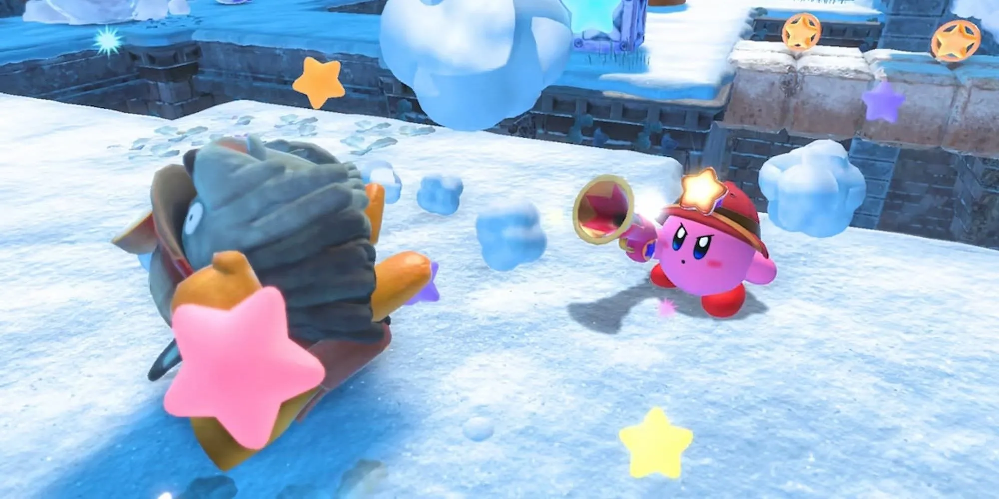 Kirby đang bắn kẻ thù trong game Kirby and the Forgotten Land