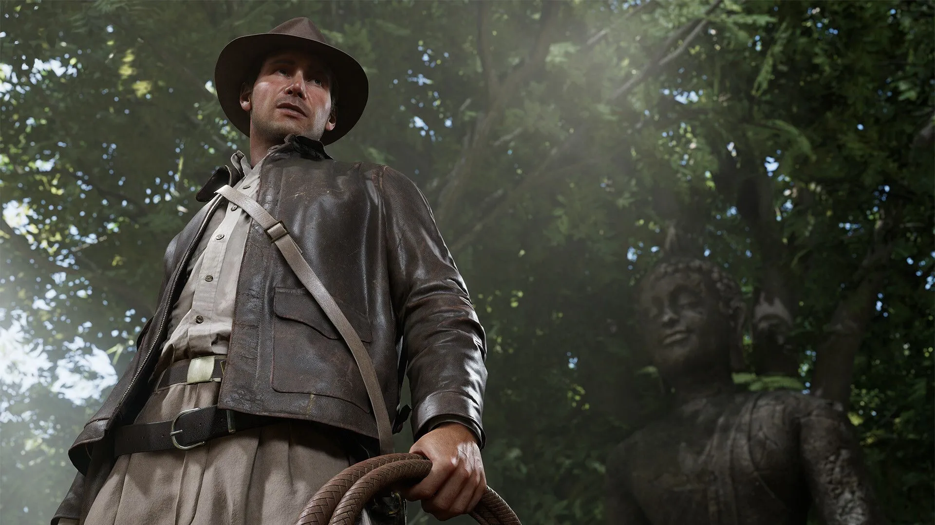 Nhân vật Indiana Jones trong một cảnh của game The Great Circle với thông tin về ngày phát hành trên PS5