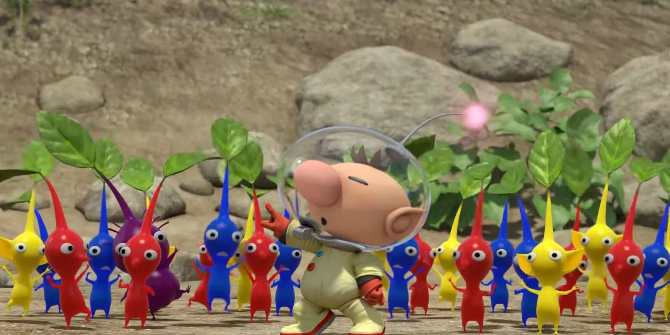 Olimar chỉ huy nhóm Pikmin đỏ, xanh, vàng, tím trong game Pikmin 3