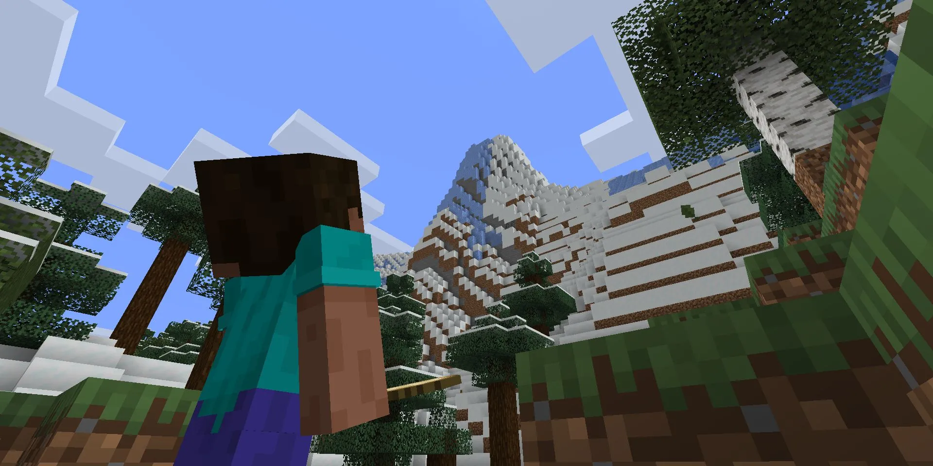 Steve trong Minecraft đang ngước nhìn một vách đá khổng lồ sau cập nhật Caves and Cliffs