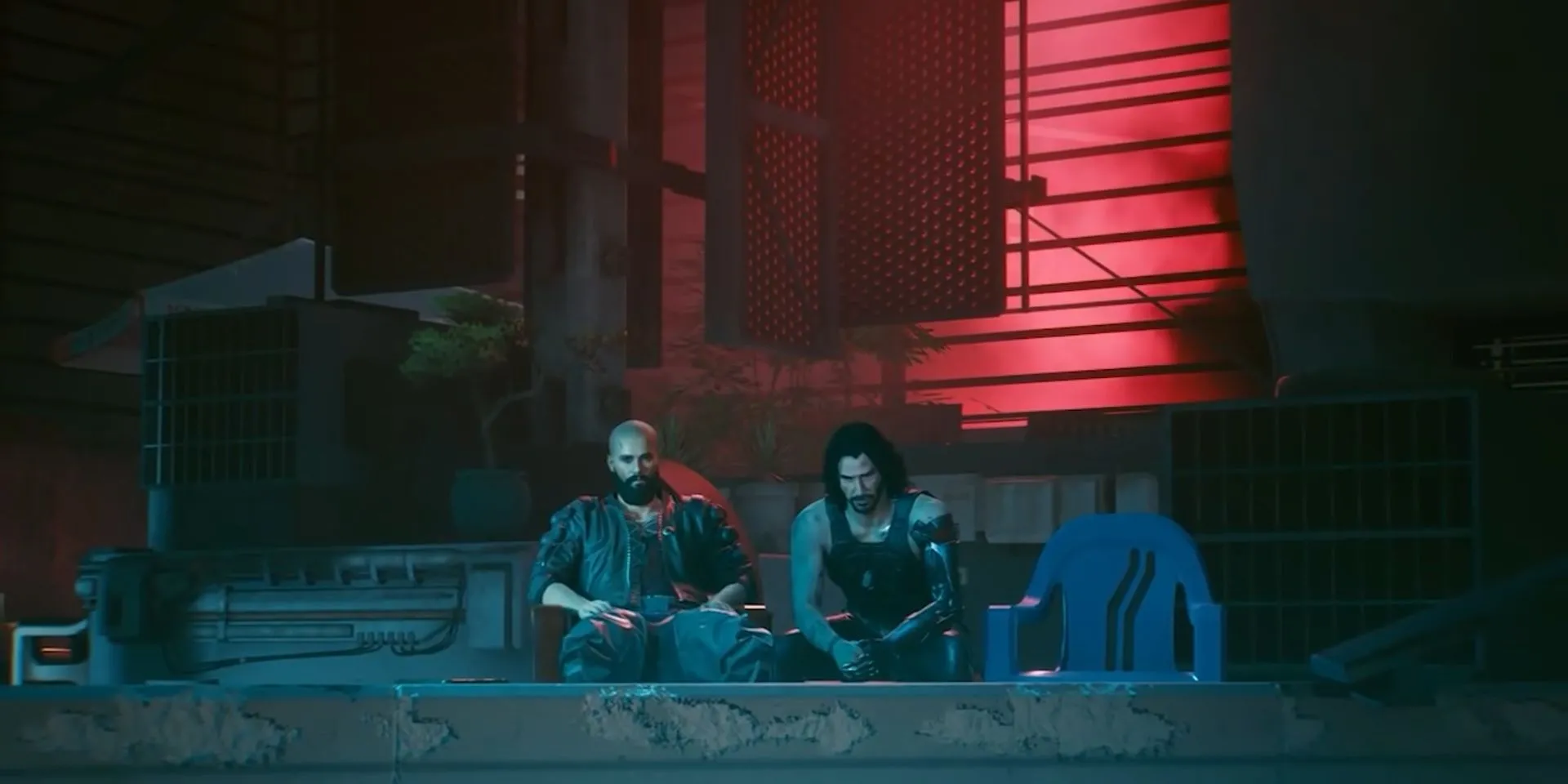 V và Johnny Silverhand ngồi trên mái nhà nhìn ra Night City trong Cyberpunk 2077