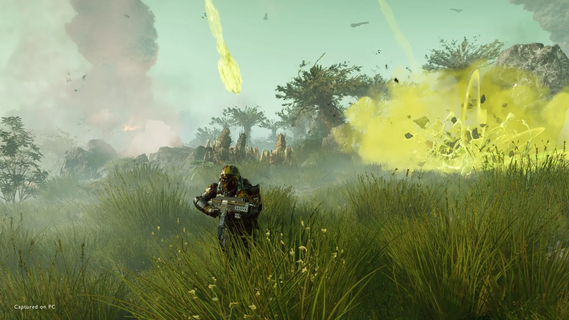 Cảnh các Helldivers cùng nhau phòng thủ trước làn sóng tấn công của quái vật ngoài hành tinh.