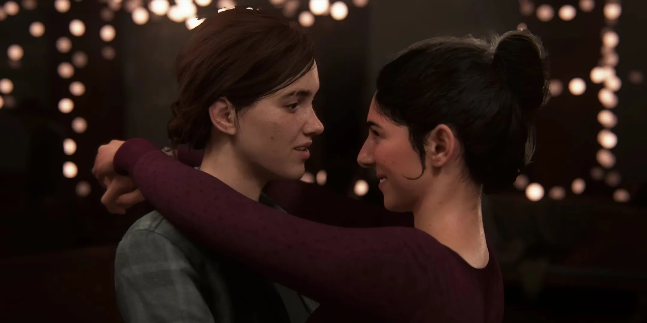 Ellie và Dina bên nhau trong The Last of Us Part 2, tượng trưng cho mối quan hệ phức tạp và đầy thử thách.